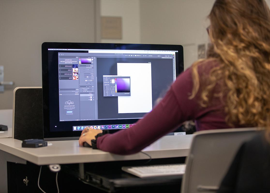 Image is of a student working on a computer